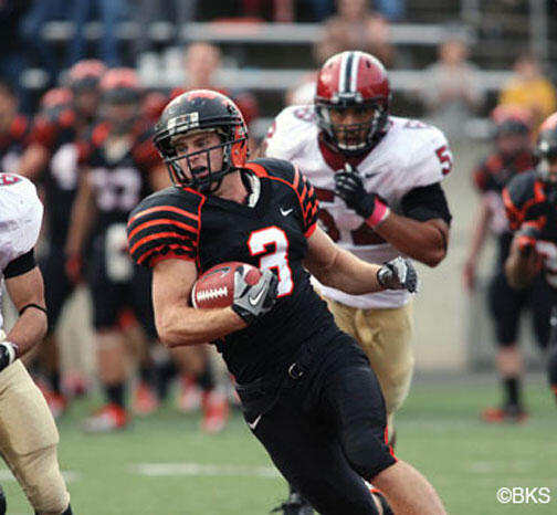 SP_FB-Harvard0858_sq.jpg Roman Wilson ’14, shown in the fourth quarter, caught a 36-yard touchdown pass with 13 seconds left in the game to give the Tigers a 39–34 victory over Harvard.