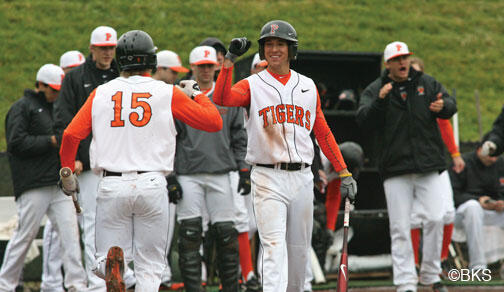 SP_baseball.jpg Much of the Tigers’ success this season comes from its versatile roster. Players such as Matt Bowman ’13 (at center facing camera, greeting Jonathan York ’14) play more than one position.