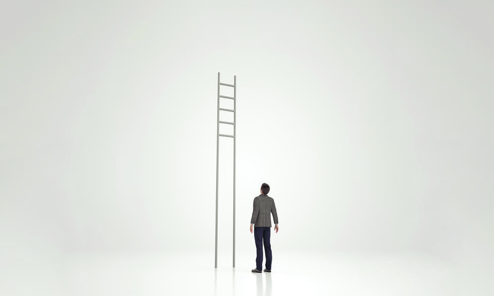 Man looking at ladder with rungs out of reach