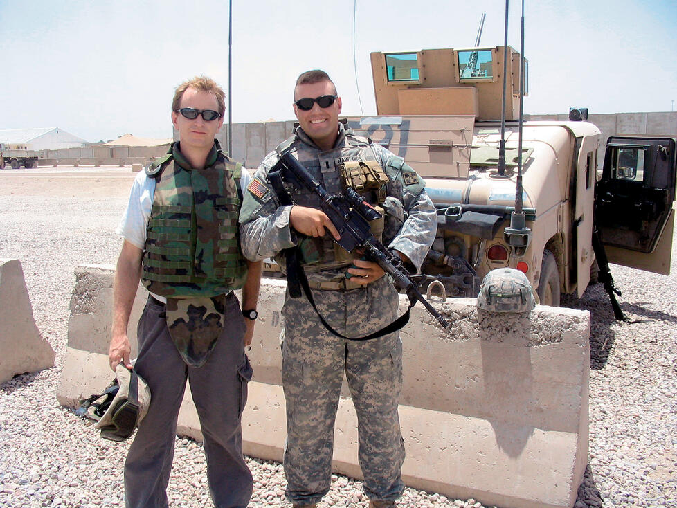 WN.jpg Author Whitney Terrell, left, with Nate Rawlings '04 at Camp Liberty in Iraq in July 2006.