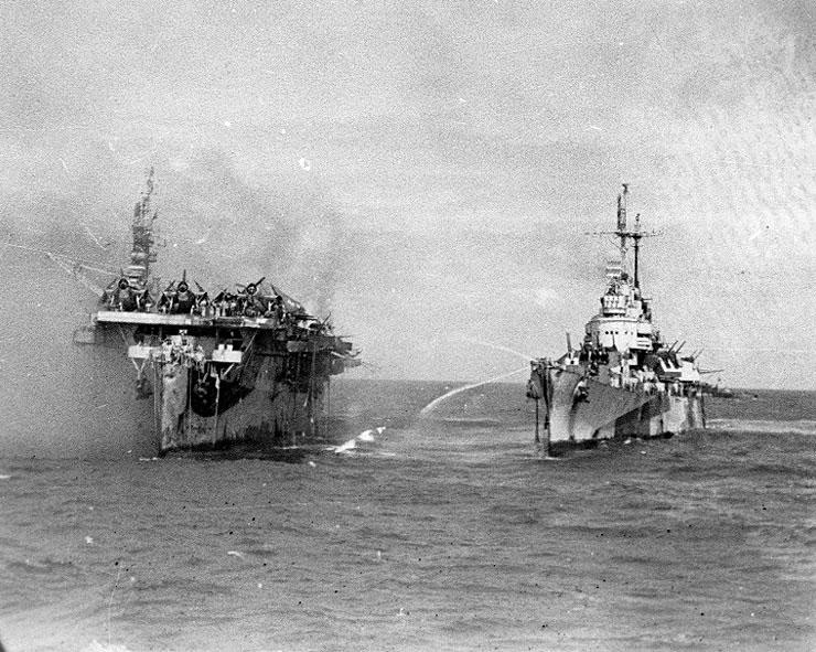 1944 - The USS Princeton afire (left) and the USS Birmingham: On the sea.