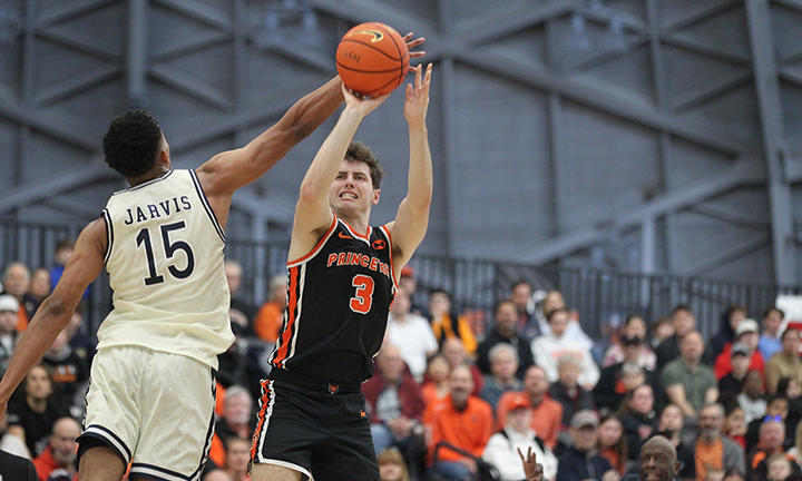 Ryan Langborg shoots while a Yale defender attempts to block him