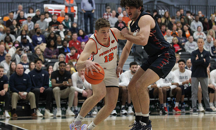 Princeton player Caden Pierce dribbles along the baseline