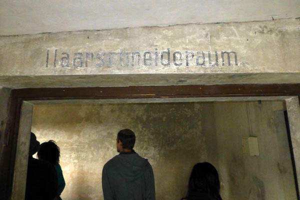 At Birkenau, Eric Silberman ’13 examines the barbering room.