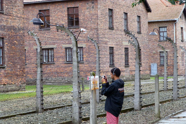 Quintin Sally ’14 takes pictures at the Auschwitz concentration camp.