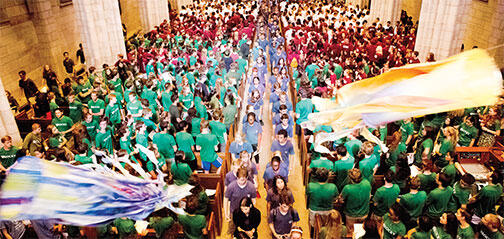 Kites ﬂy overhead as freshmen leave the University Chapel to begin the Pre-rade