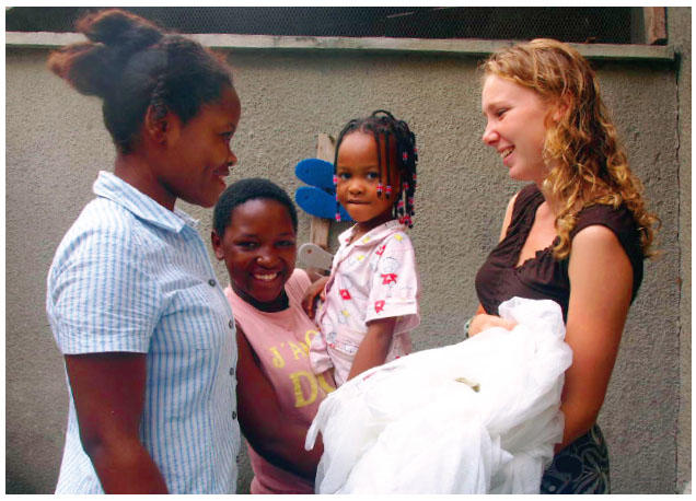 Recent graduates like Kimberly Bonner ’08, pictured here in Tanzania distributing bed nets to combat malaria, have often engaged in international public service. Now our incoming freshmen will have a chance to do so, too.