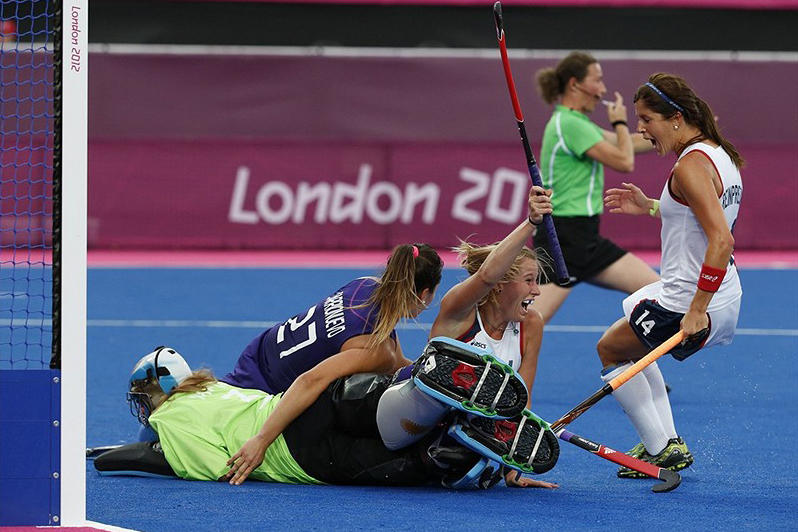 July 31: Katie Reinprecht '13, right, celebrates a goal by U.S. field hockey teammate Shannon Taylor during the Americans' win over Argentina. It was Team USA's only victory in London; Argentina went on earn claim silver. 