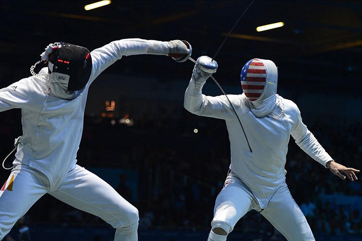 Aug. 1: Returning to the Olympics after an eight-year absence, Soren Thompson '05, right, lost his opening match to Germany's Joerg Fiedler in the single-elimination men's individual epee draw.