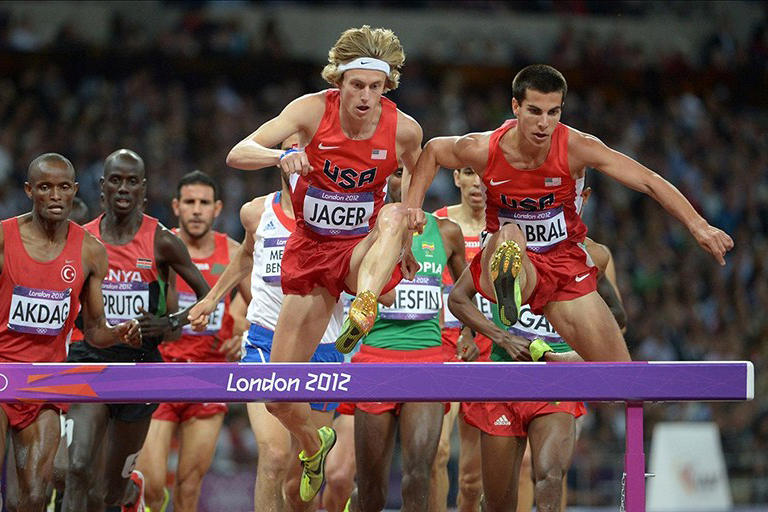 Aug. 5: Donn Cabral '12, right, and U.S. teammate Evan Jager led the pack early in the Olympic men's steeplechase final. Cabral placed eighth in the 15-athlete field, seven seconds behind gold medal winner Ezekiel Kemboi of Kenya.