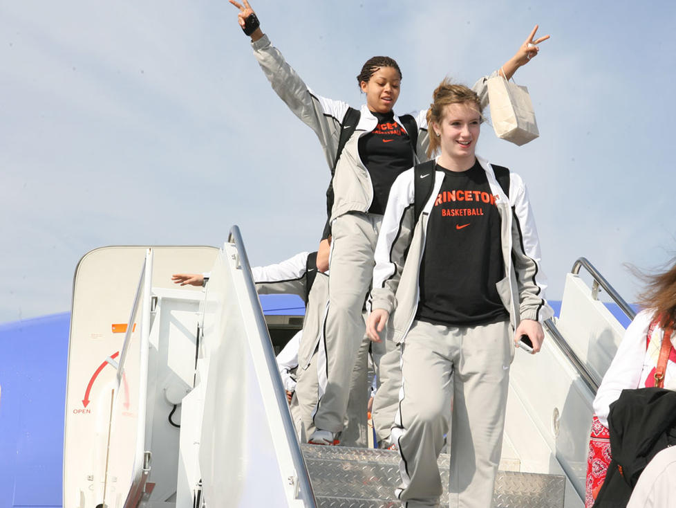 Sophomore Mariah Smith gives a Nixon-esque salute as the Tigers exit the plane in Texas.