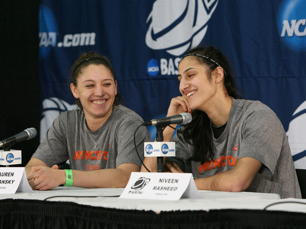 Longtime friends Lauren Polansky '13, left, and Niveen Rasheed '13 share a light moment at the March 23 pregame press conference.