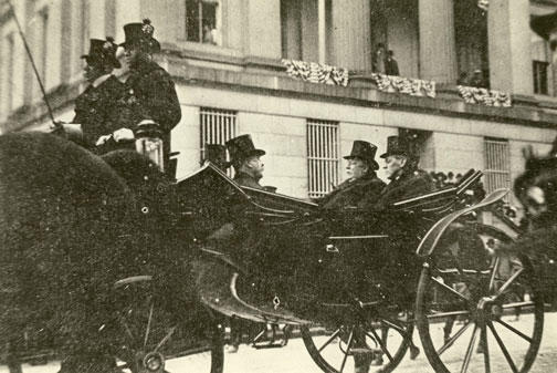 Wilson and Taft share a carriage on inauguration day in 1913.